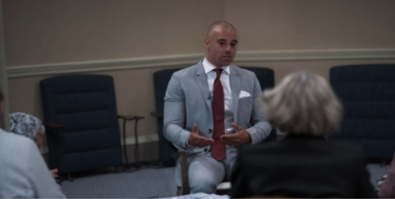 Charles Thomas discussing property with a small group